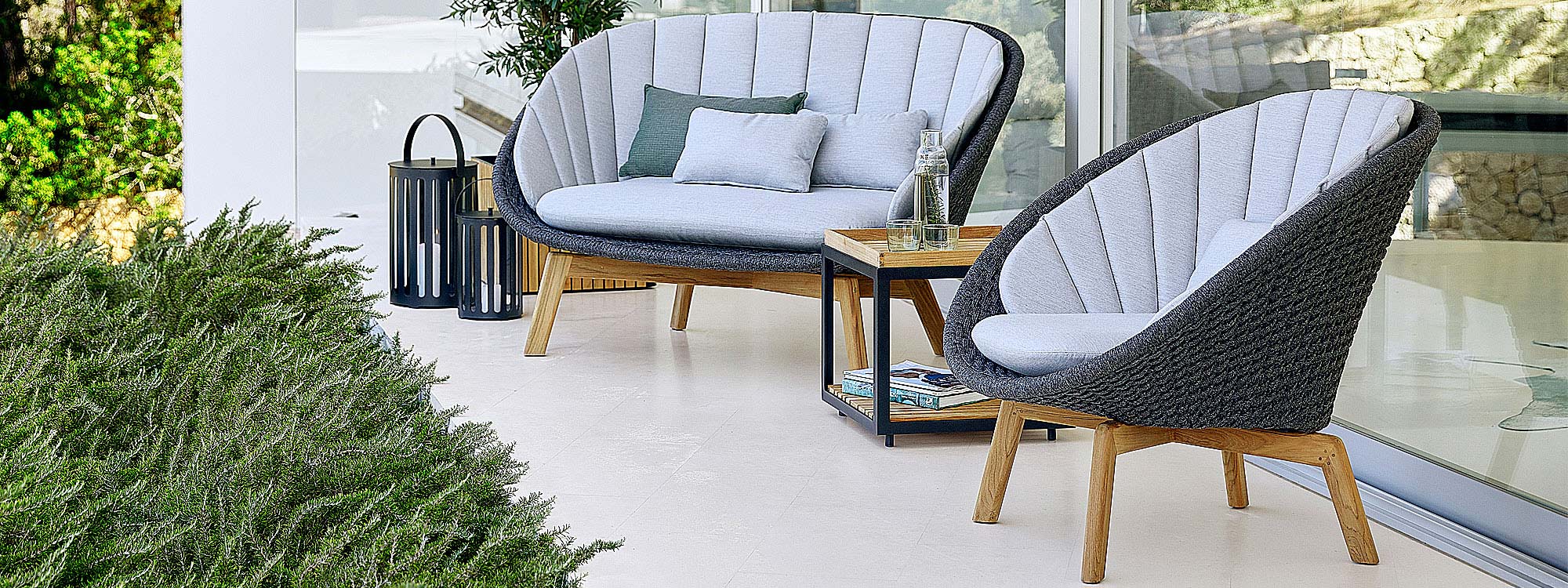 Peacock garden easy furniture includes a designer 2 seat garden sofa & modern outdoor lounge chair in all-weather furniture materials by Cane-line.