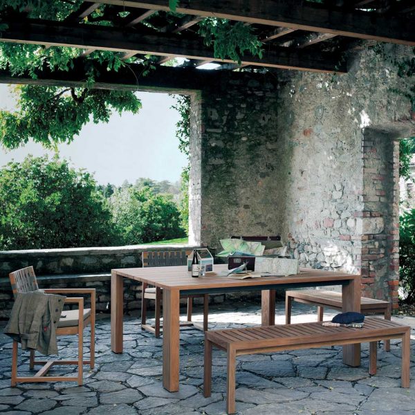 Image of RODA Pier modern teak garden table and Harp teak chairs in rustic Italian garden room