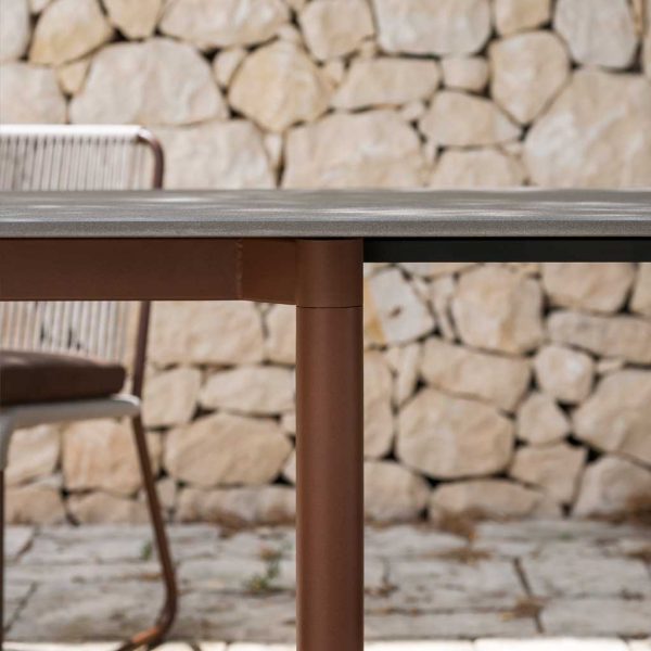 Image of detail of tubular powder coated leg and ceramic top of Piper extending garden table by RODA