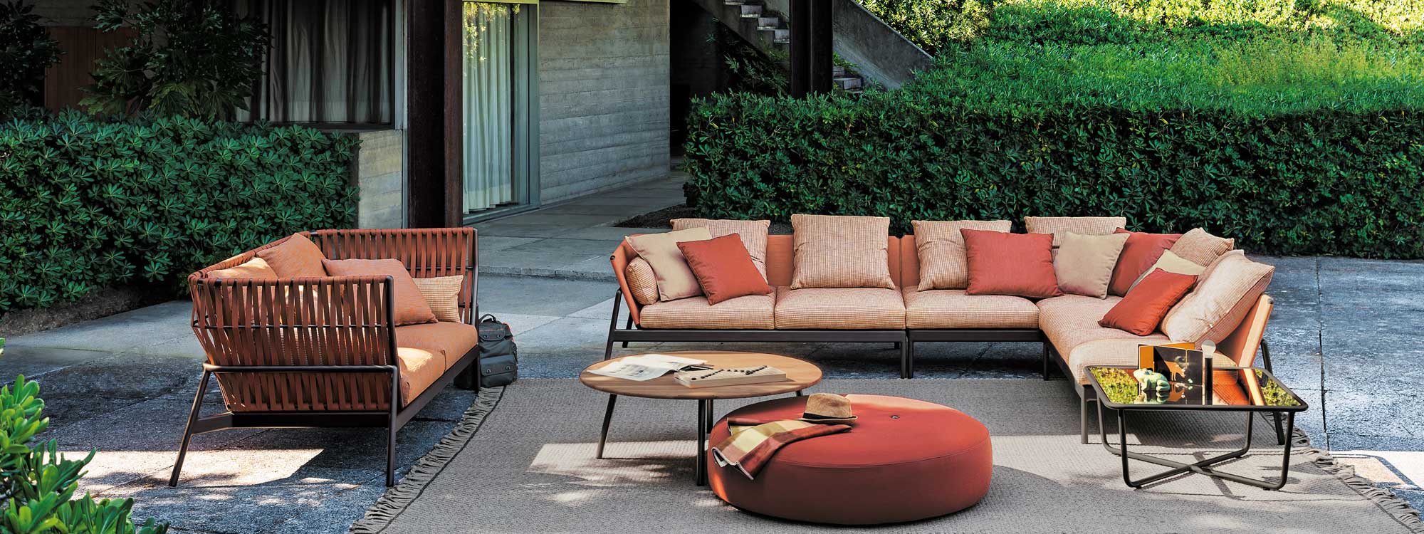 Piper garden sofas in vibrant orange on minimalist terrace