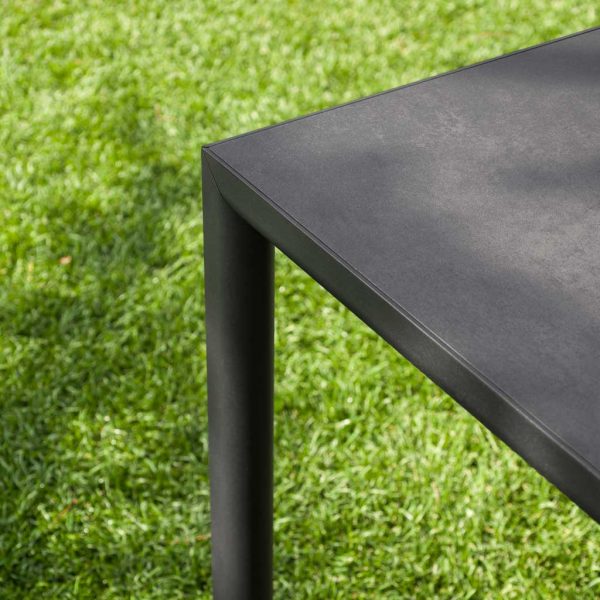 Image of detail of RODA Plein Air garden table's leg and top which seamlessly join one another