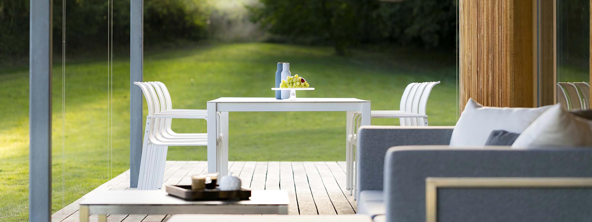 Puro modern garden dining set & Lotos outdoor sofa on decking