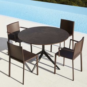 Image of Vondom Quartz injection molded restaurant furniture on sunny poolside