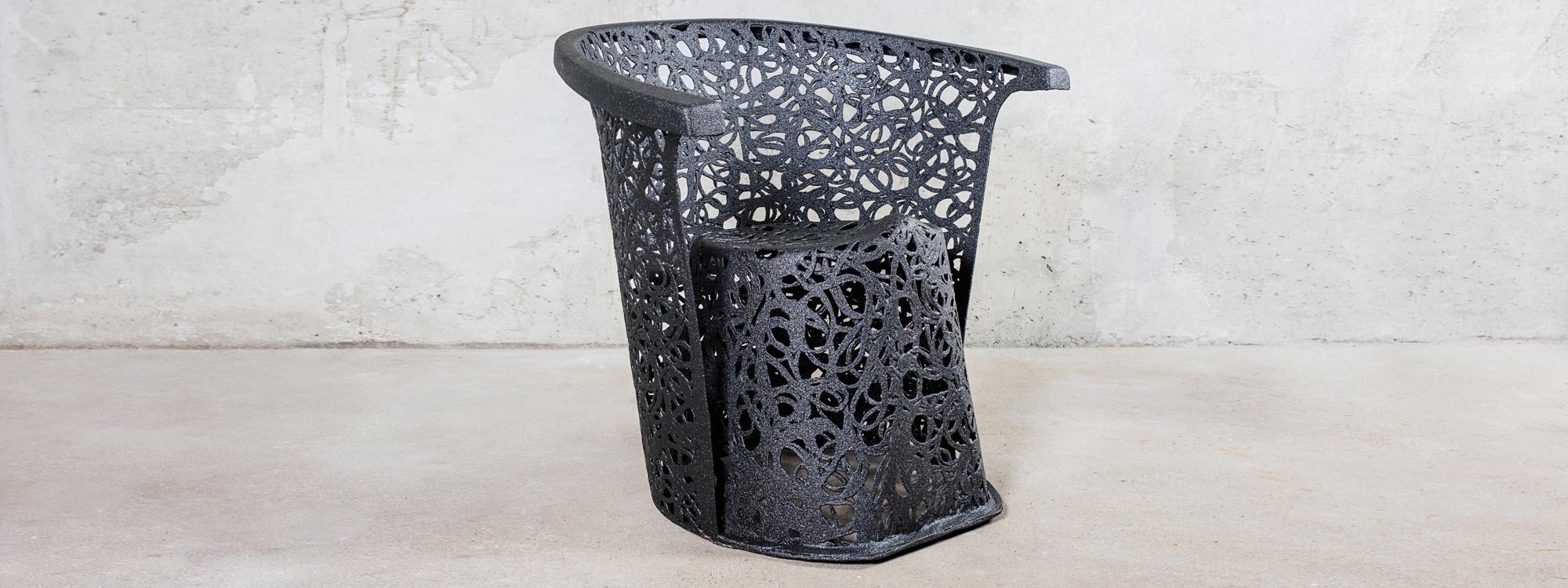 Image of black Race armchair, individually hand-made in basalt fiber by Unknown Furniture