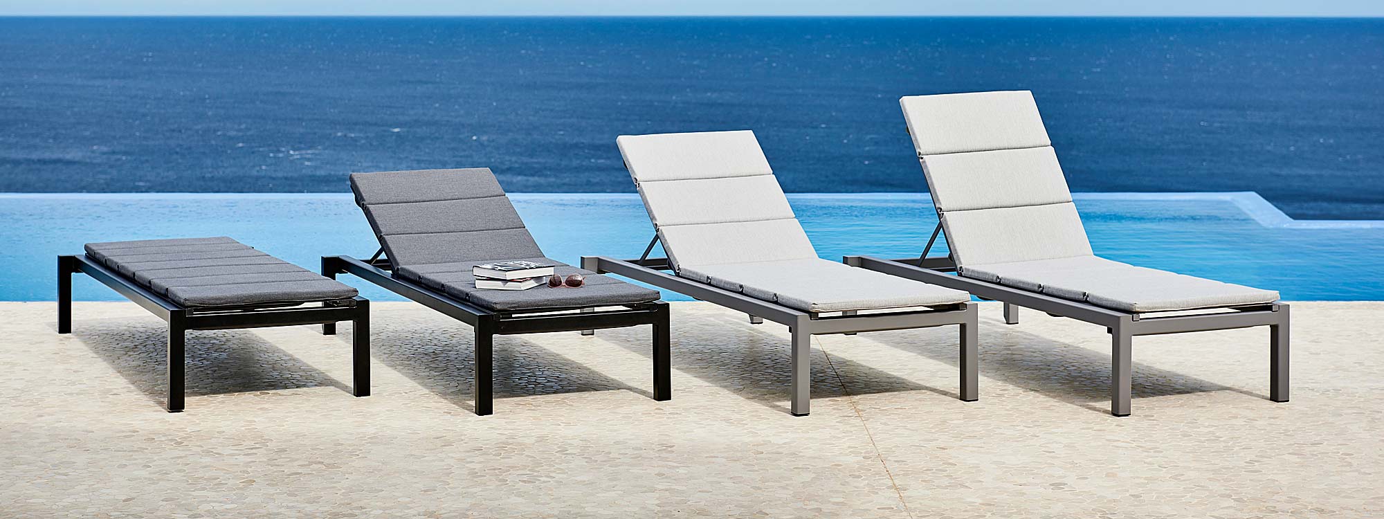 Image of 4 Relax minimalist sun loungers with head rests in different postures by Cane-line