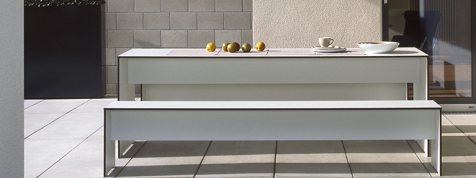 Image of RIVA large table and bench seats in white HPL by Conmoto Germany