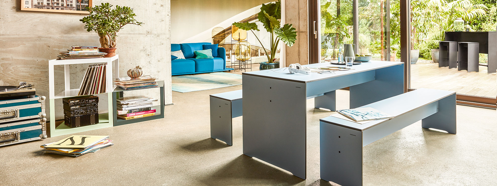Image of RIVA white table and benches by Conmoto, shown in modern house