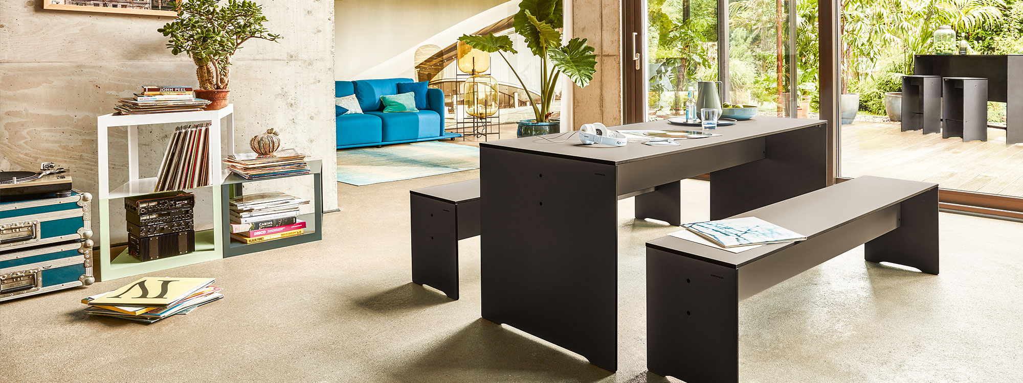 Image of anthracite coloured RIVA table and benches by Conmoto in trendy modern house
