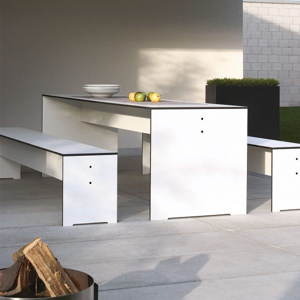 Riva White garden table and benches on concrete terrace