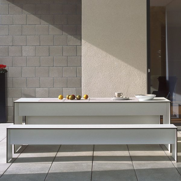 Image of RIVA white garden table and modern bench seats by Conmoto Germany