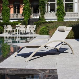 Image of taupe O-ZON lounger next to swimming pool by Royal Botania discounted garden furniture