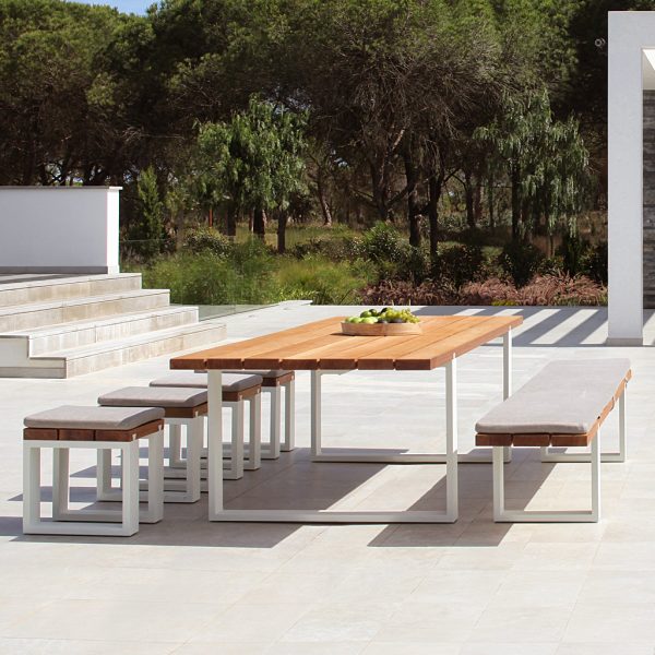 Image of Royal Botania Vigor teak dining table and bench seats with white frames