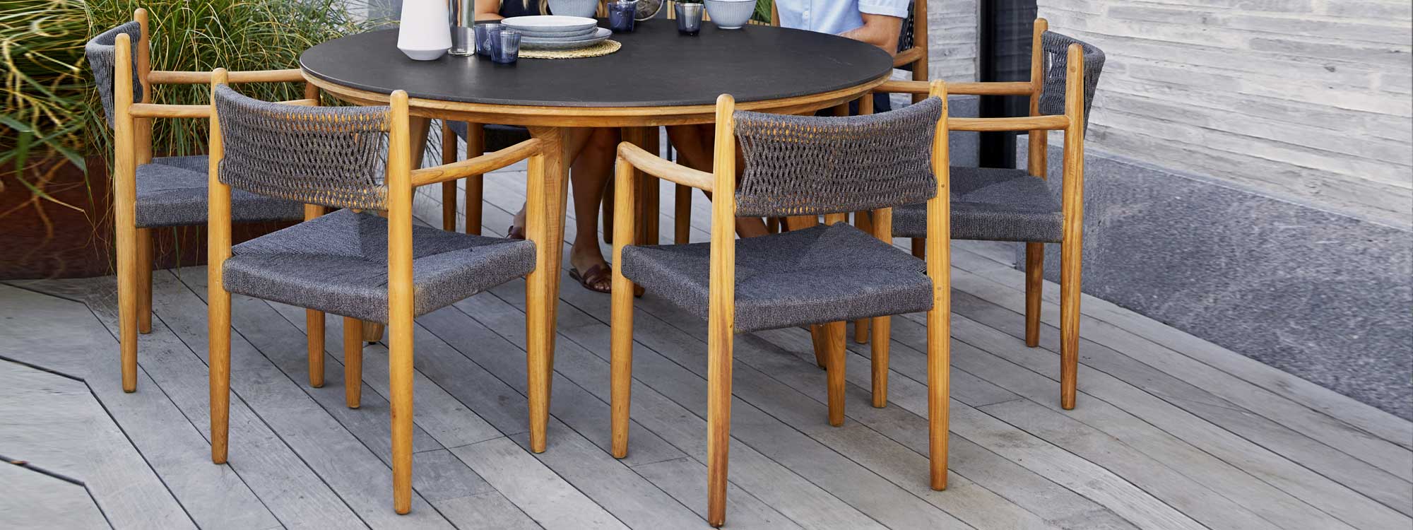 Image of Royal Teak armchairs with grey SoftRope seat and back by Caneline garden furniture