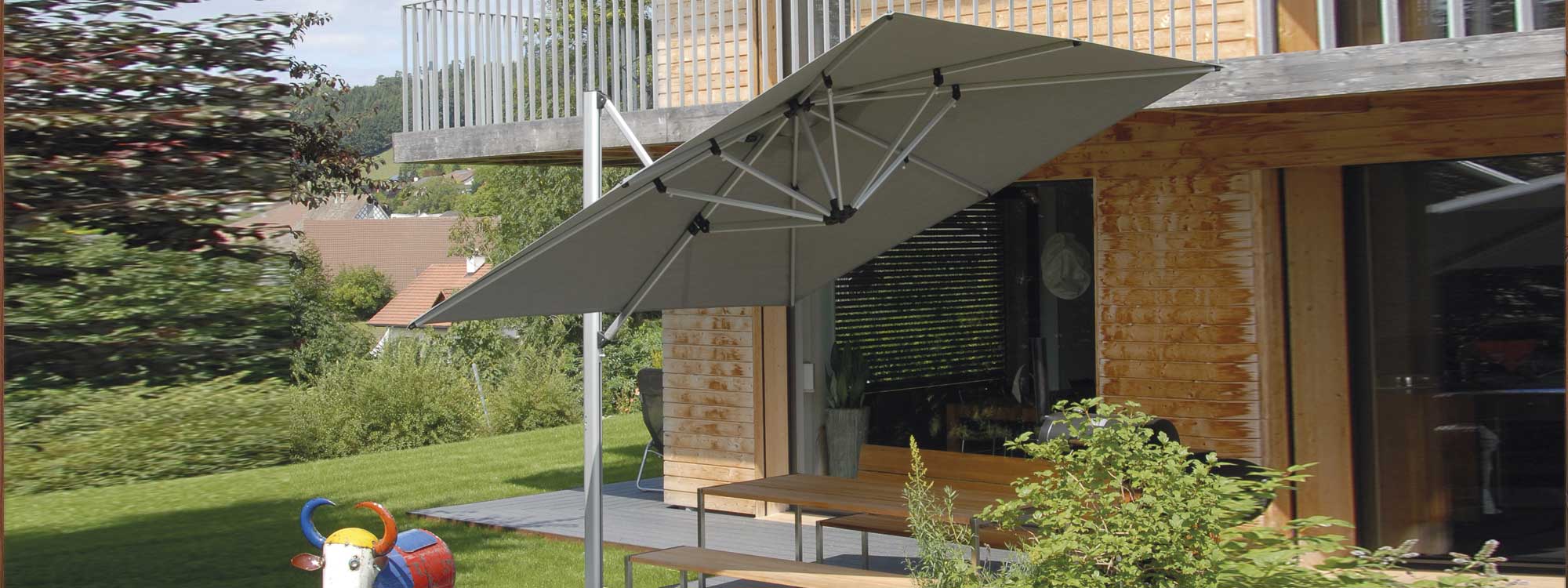 Sirius cantilever parasol is a tilting and revolving sunshade in marine grade parasol materials by Shademaker high quality parasol company.