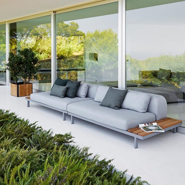 Image of Space long garden corner sofa in light grey and teak by Caneline