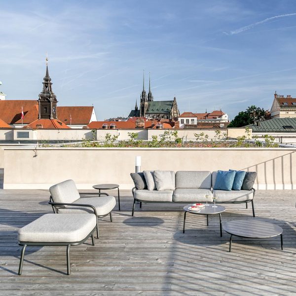 Image of Todus Starling lounge furniture on rooftop terrace in Czech Republic with church spires in background