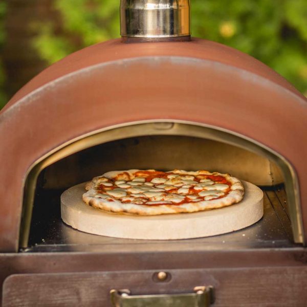 Image of a pizza cooking inside M-Classic wood-fired pizza oven, in oxidised corten steel