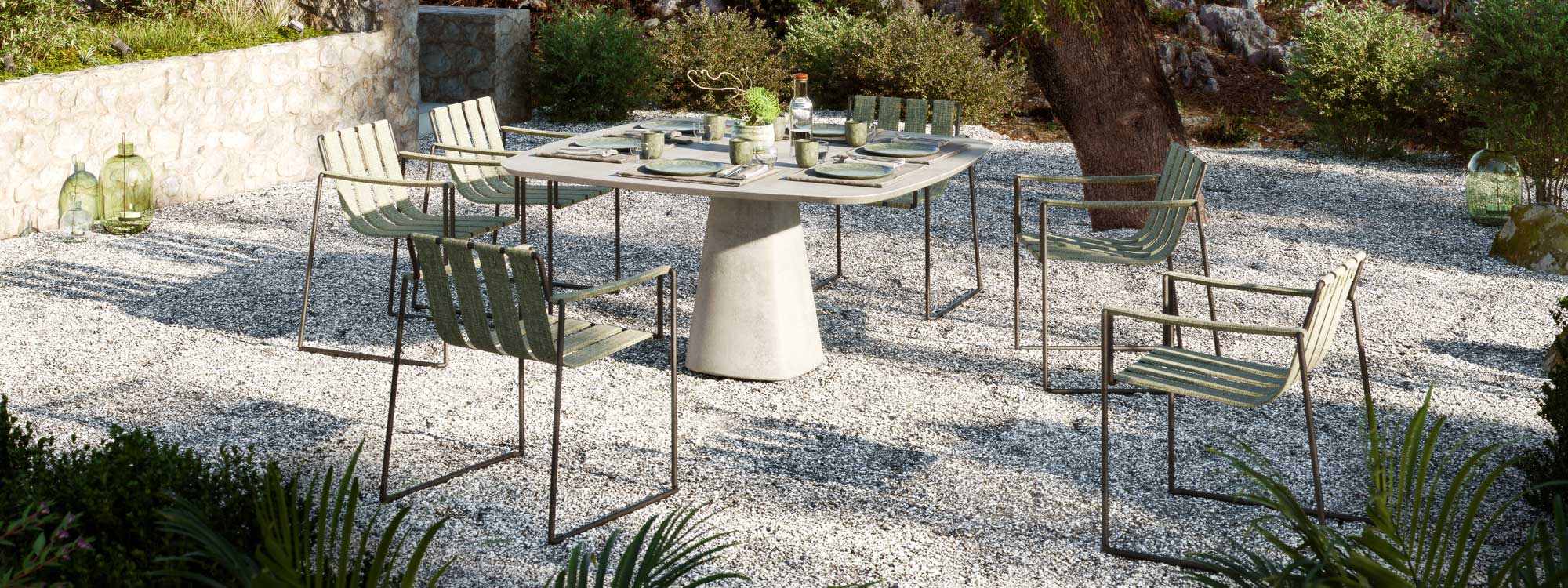 Image of green Strappy chairs and square Conix table by Royal Botania on gravel terrace