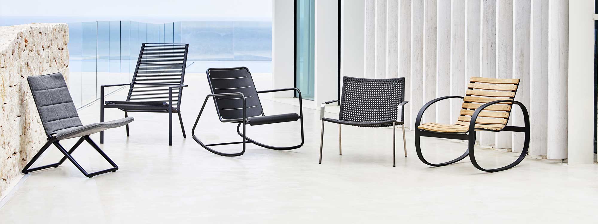 Image of Caneline lounge chairs, including Edge high back chair, Straw stacking chair, Traveller folding chair and Copehagen rocking chair