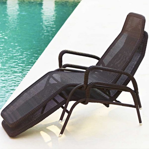 Image of pair of Sunrise stacking recliner chairs on poolside by Caneline