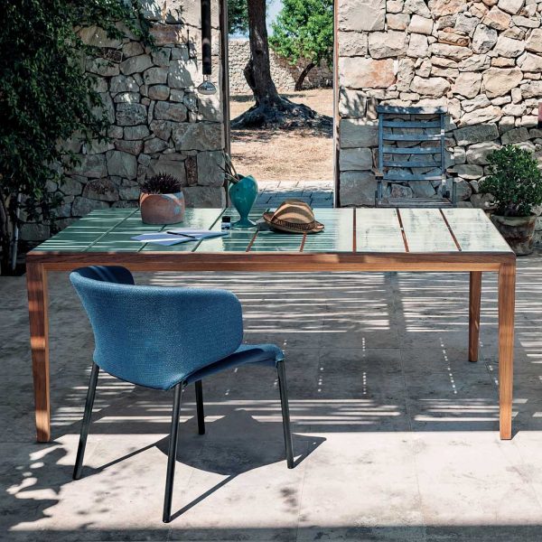 Image of RODA Teka outdoor teak table with gloss ceramic table top, together with Double upholstered garden chairs in blue