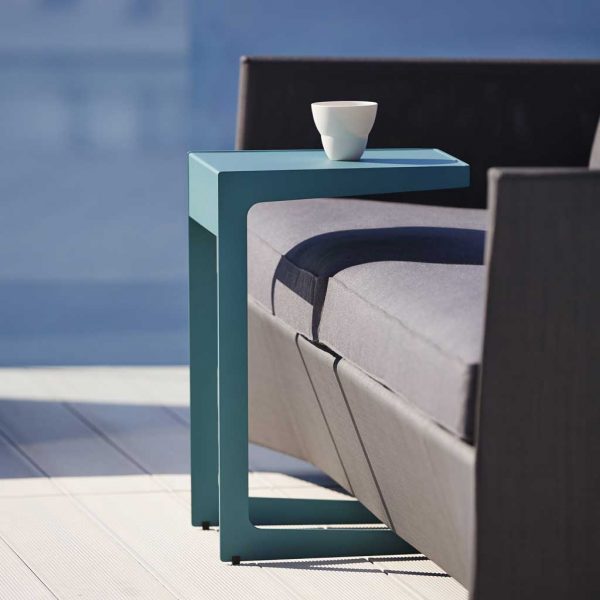 Image of Time Out cantilevered side table over Diamond garden sofa by Caneline outdoor furniture