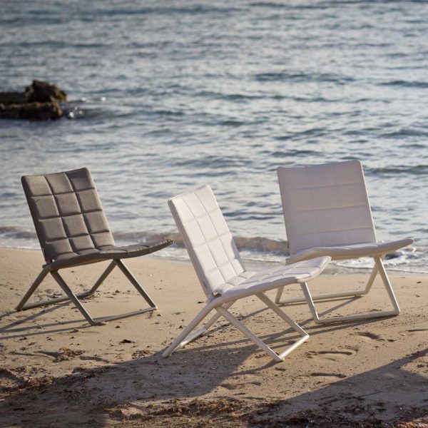 Image of Traveller folding relax chairs on beach by Caneline garden furniture company