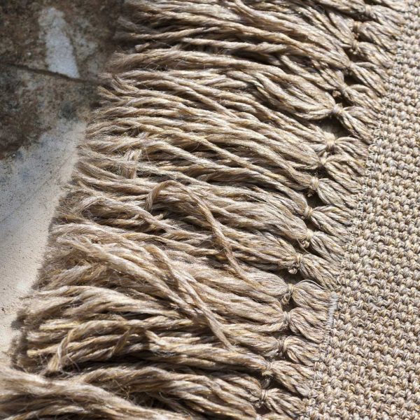 Image of detail of fringe of RODA Triptyque luxury outdoor rug in natural finish