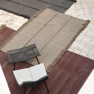 Triptyque outdoor carpet with Laze modern garden lounge chair and footstool by RODA