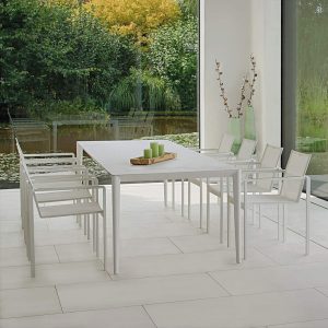 White Unite & Alura modern garden table & chairs is a luxury outdoor dining set in all-weather dining set materials by Royal Botania furniture Co.