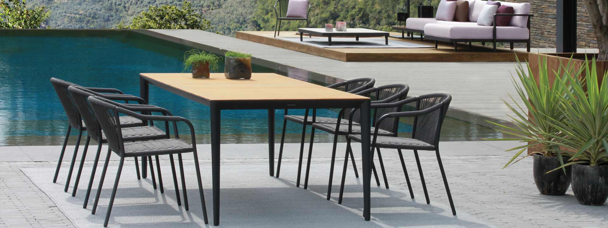 Image of Samba garden chairs and U-nite table with teak top by Royal Botania