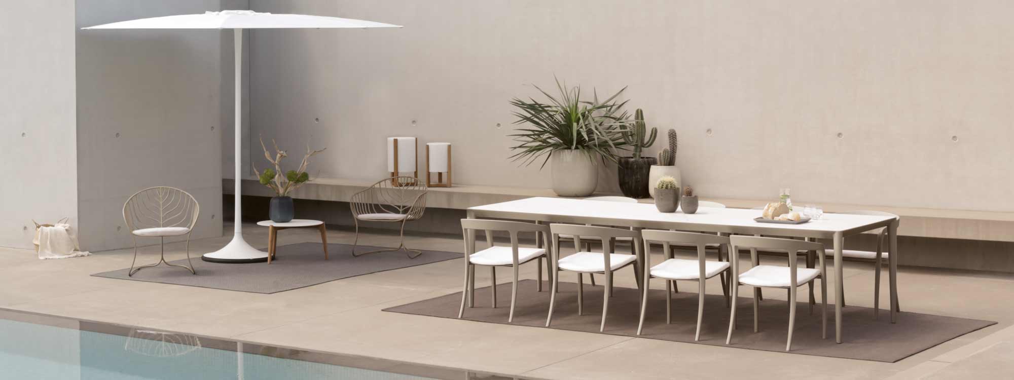 Image of sand-colored Jive chairs and U-nite garden table by Royal Botania.