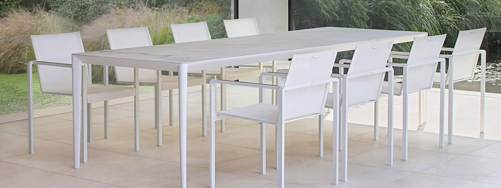 Image of White Alura chairs & Unite table with Bianco Statuario ceramic top by Royal Botania