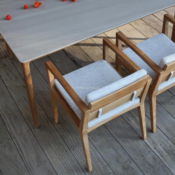 Birdseye image of Zenhit teak chairs and U-nite teak table with grey ceramic table top by Royal Botania