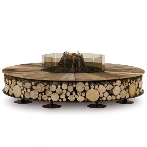 Image of Zero Wood circular fire pit with fire wood stacked inside the fire pit's integrated log store