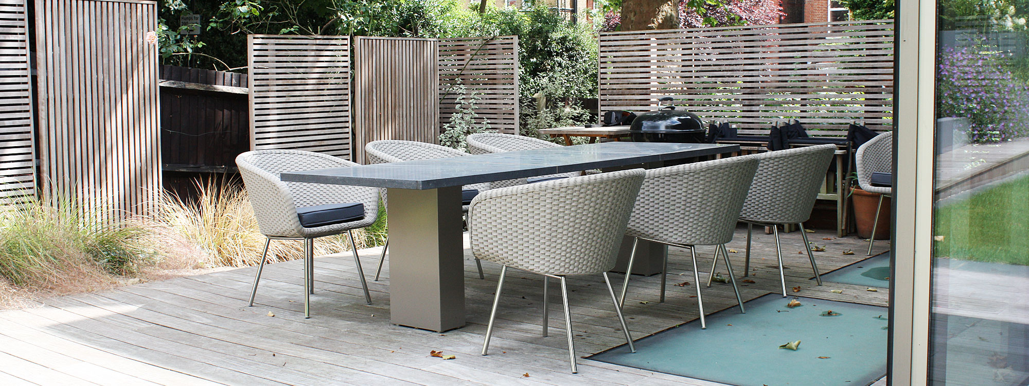 photo showing Modern Garden Furniture London Project Of FUERADENTRO Minimalist Garden Furniture. High End Outdoor Dining Furniture In Premium Garden Furniture Materials.