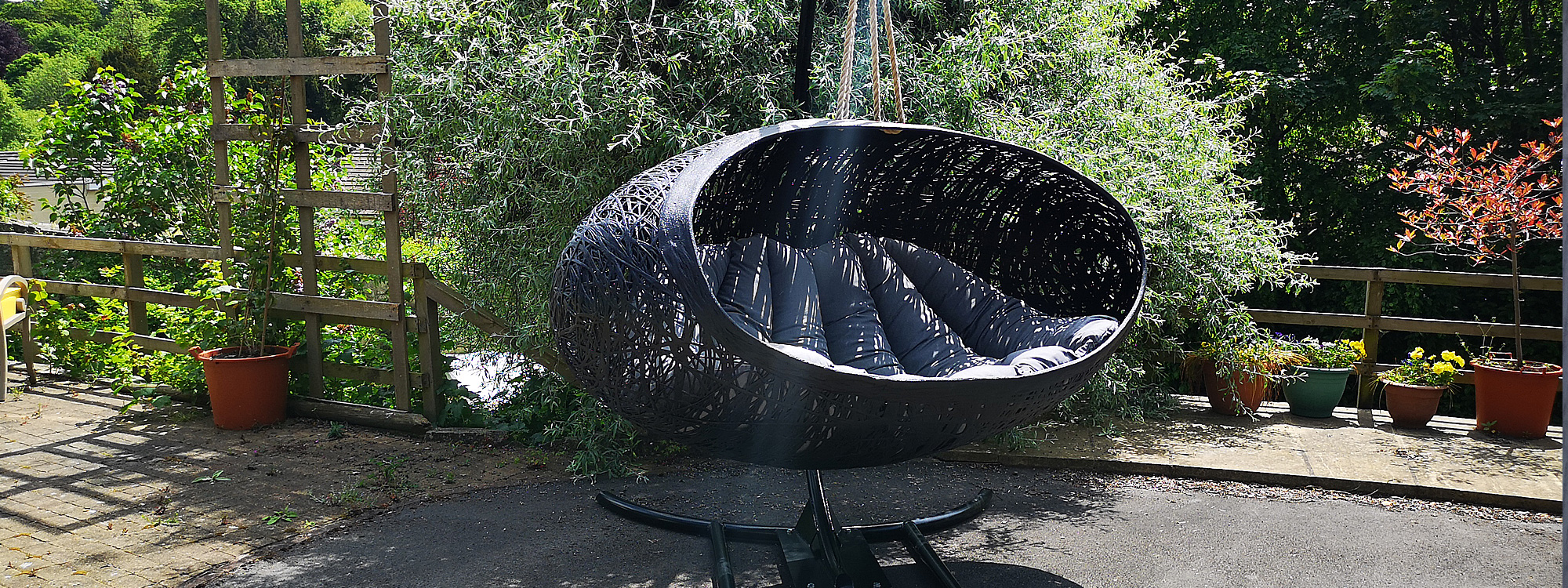 View Installation Of Alpha Modern Garden Swing Seat - Hanging Garden Pod In High Quality Swing Sofa Materials By Unknown Swing Chair Company.
