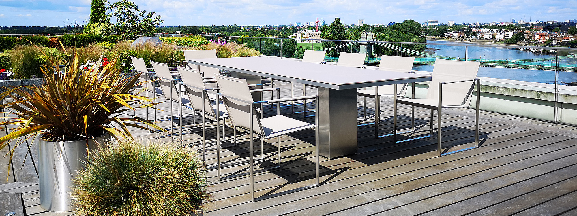 Photo of modern architectural outdoor dining table and chairs on London roof top