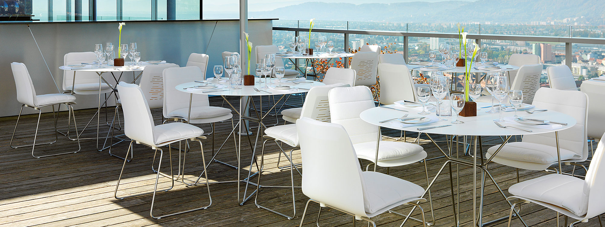 white-Corian-contract-stacking-chairs-and-tables-contemporary-design.jpg