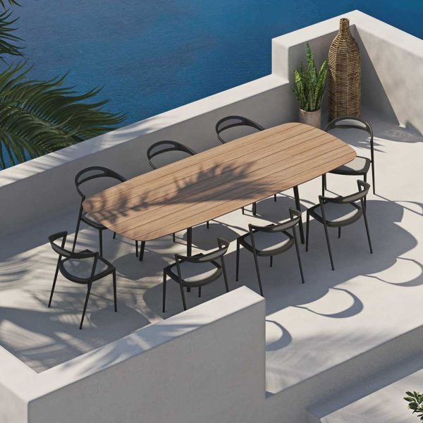 Image of Styletto teak garden table and aluminium garden chair by Royal Botania on whitewashed terrace
