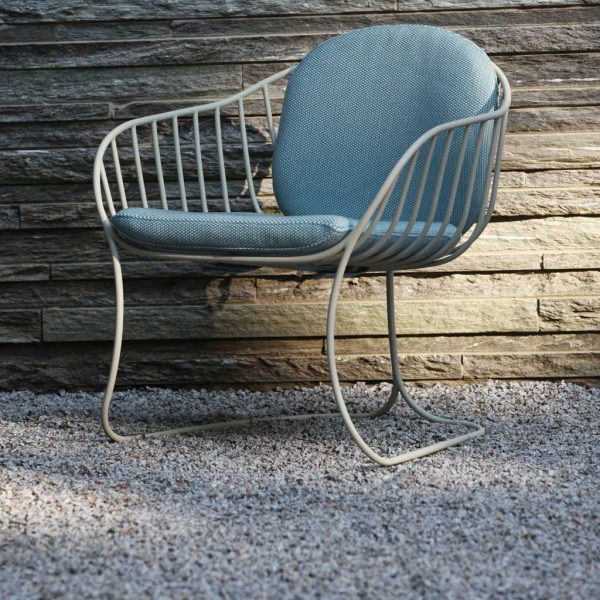 Image of sand-coloured Folia lounge chair with light-blue cushion by Royal Botania