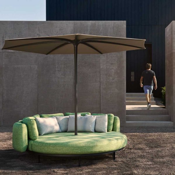 Image of green Organix garden day bed fitted with Palma parasol by Royal Botania