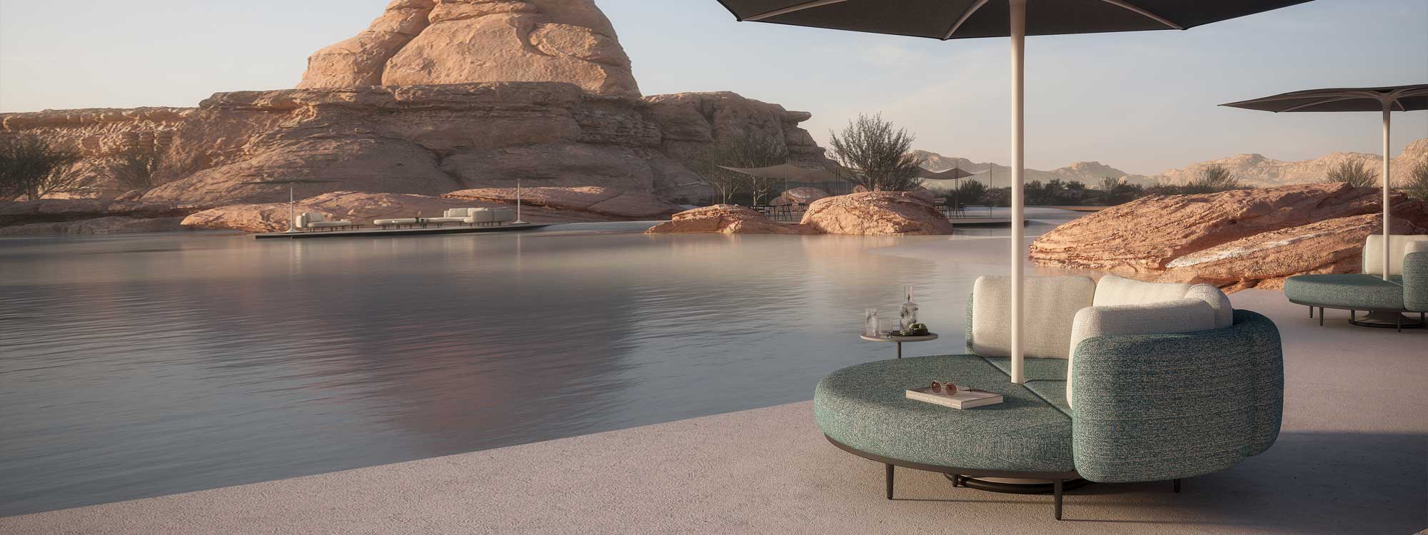 Royal Botania Organix daybed on shore of oasis surrounded by arid mountains