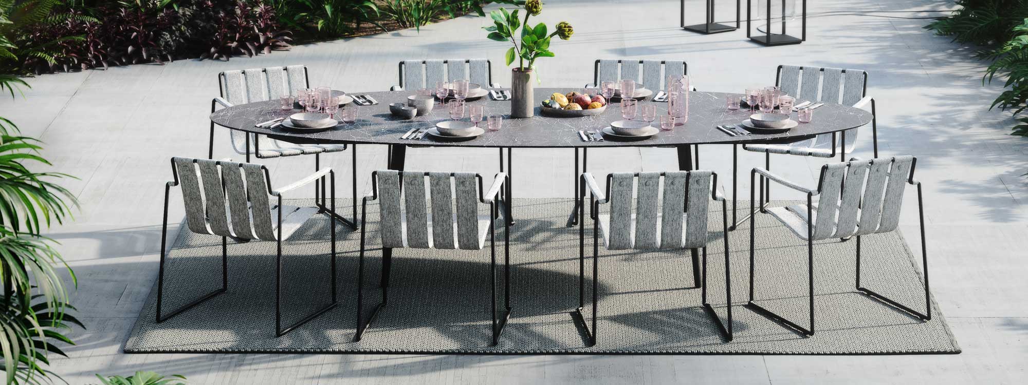 Strappy & Styletto garden dining set has an elegant outdoor table & minimalist garden chair by Royal Botania luxury outdoor dining furniture.