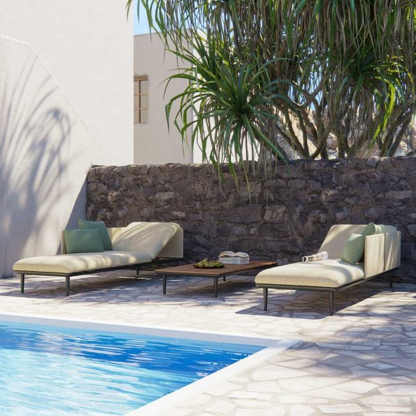 Image of pair of Styletto garden sun beds with olive upholstery around poolside