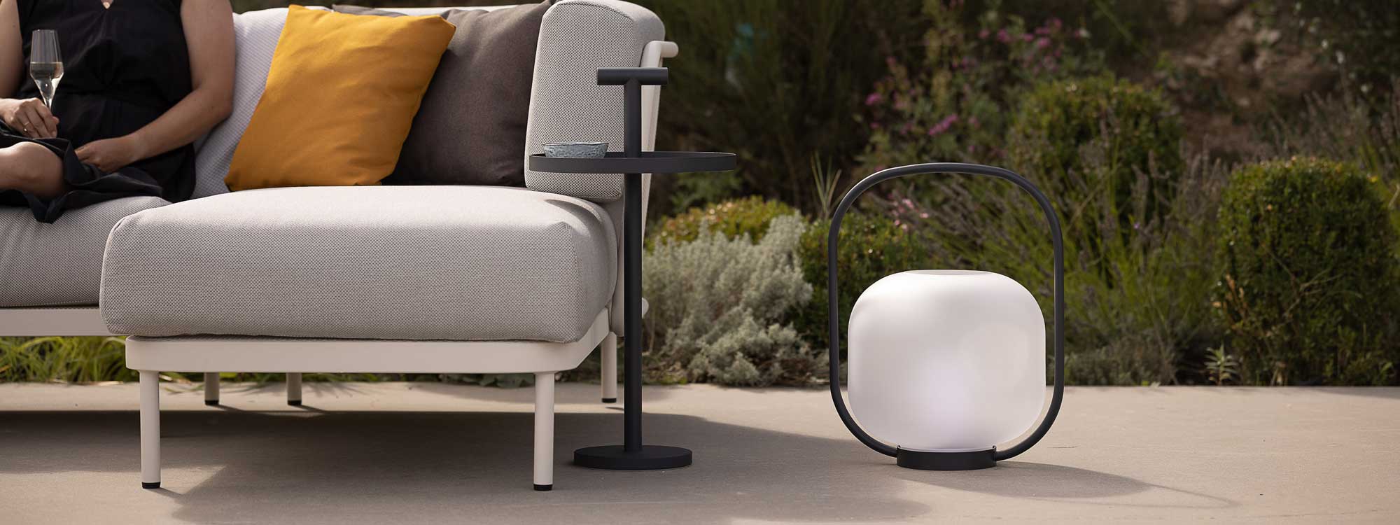 Albus table with handle is a groovy modern garden side table in all weather outdoor table materials by Todus luxury garden furniture.