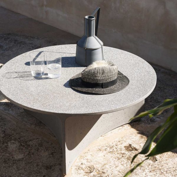 Image of RODA Aspic modern concrete garden table in sunny outdoor spot