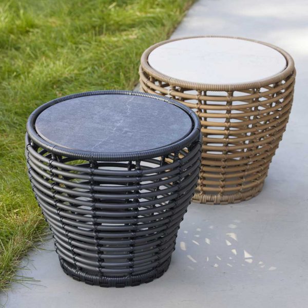 Image of pair of Basket tables in graphite and natural cane with ceramic table tops by Caneline