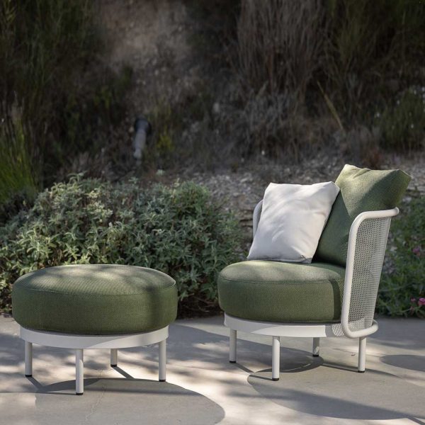 Image of Baza modern garden lounge chair and foot rest with white frames and cozy green upholstery