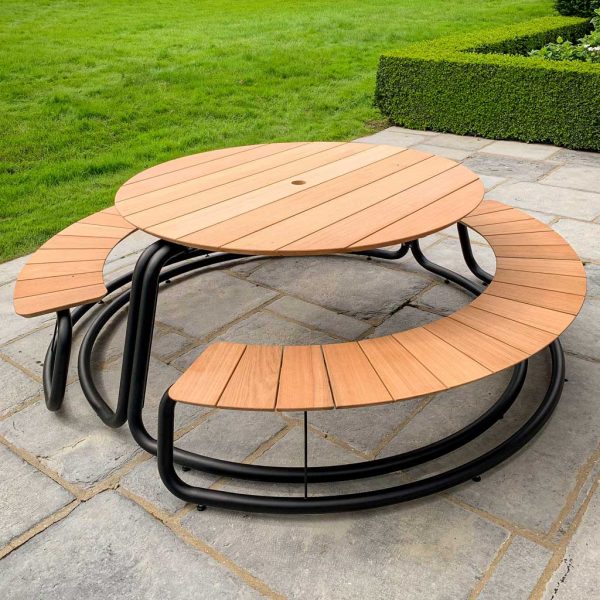 Image of The Circle contemporary picnic table and benches by Wunder in black tubular steel with surfaces in afzelia wood